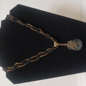 Elegant Black and Gold Pendant Necklace.